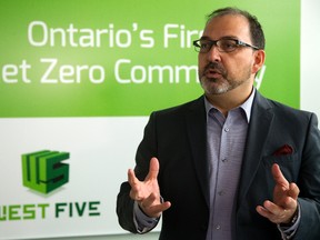 Ontario Energy Minister Glenn Thibeault tours Sifton?s new energy efficient head office Monday in its West Five community on Oxford Street West. (MIKE HENSEN, The London Free Press)