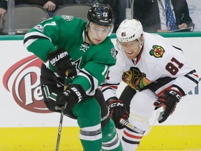 Stars’ Devin Shore (left) and Blackhawks’ Marian Hossa chase the puck during a recent game. The Stars are currently out of a playoff position in the Western Conference. (AP)