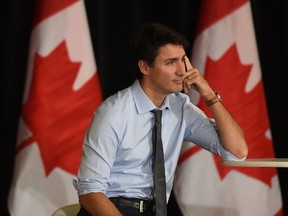 Prime Minister Justin Trudeau listens to a question as he speaks with youth leaders from universities attending a conference in Ottawa, Monday, February 6, 2017. (THE CANADIAN PRESS/Adrian Wyld)