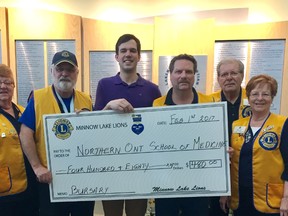 Minnow Lake Lions Club members Shirley Ogilvy, Keith Argent, John Roy, Walter Karen and Leanne Furchner present a cheque to NOSM student Sam Merrifield, middle. Supplied photo