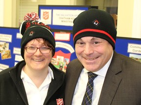 Chatham Coun. Derek Robertson, right, pictured with Capt. Stephanie Watkinson, is among the local residents who stopped by the Salvation Army Chatham Family Services location in Chatham, Ont. on Tuesday February 7, 2017 to purchase a toque to support the Raising the Roof's annual Toque Tuesday event to help find long-term solutions to homelessness. Ellwood Shreve/Chatham Daily News/Postmedia Network
