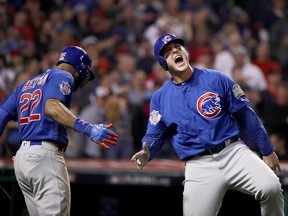 Anthony Rizzo (right) of the Chicago Cubs celebrates with Jason Heyward during Game 7 of the World Series at Progressive Field on November 2, 2016 in Cleveland. The Cubs defeated the Cleveland Indians 8-7. (Ezra Shaw/Getty Images)