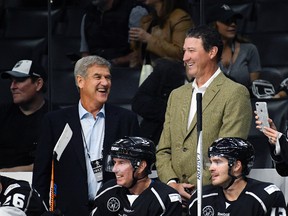 Coaches Bobby Orr, left, and Mario Lemieux laugh during the NHL All-Star Celebrity Shootout at Staples Center, Saturday, Jan. 28, 2017, in Los Angeles. (AP Photo/Mark J. Terrill)