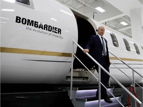 Bombardier CEO Alain Bellemare exits a Global 7000 jet at Bombardier in Montreal on February 7, 2017. (Allen McInnis / MONTREAL GAZETTE)