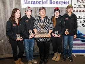 Val Smith presents Lawson Clyke's team, including Allison Schmahl, Carter White, and Cameron DeRoo, with the Jim Smith Memorial Junior Curling Bonspiel's championship trophy at the Vermilion Curling Arena, on Saturday, February 4, 2017, in Vermilion, Alta. Clyke's team won the overall placing with 42 points. Taylor Hermiston/Vermilion Standard/Postmedia Network.