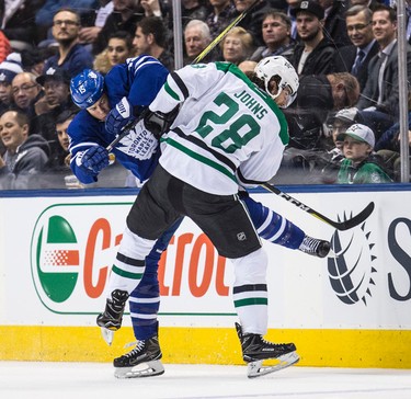 Toronto Maple Leafs left wing Matt Martin (15) and Dallas Stars defenseman Stephen Johns (28) collide in Toronto on Tuesday February 7, 2017. Craig Robertson/Toronto Sun/Postmedia Network