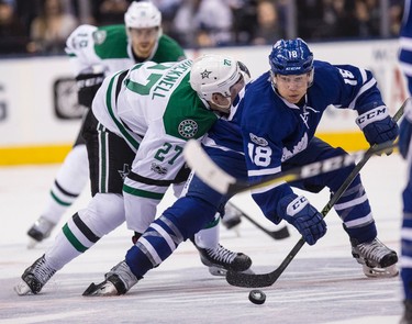 Toronto Maple Leafs right wing Ben Smith (18) shields off Dallas Stars right wing Adam Cracknell (27) in Toronto on Tuesday February 7, 2017. Craig Robertson/Toronto Sun/Postmedia Network