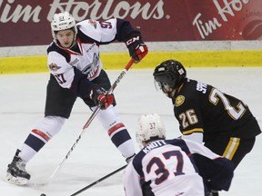 Windsor Spitfires forward Jeremy Bracco has his pass deflected by Sarnia Sting centre Franco Sproviero during an OHL game at Progressive Auto Sales Arena on Friday January 13, 2017 in Sarnia, Ont. (Terry Bridge, Postmedia News)
