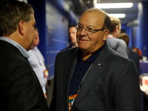 Scotty Bowman speaks with Tampa Bay Lightning chairman and governor Jeff Vinik prior to Game 2 of the Stanley Cup Final at Amalie Arena on June 6, 2015 in Tampa. (Bruce Bennett/Getty Images)