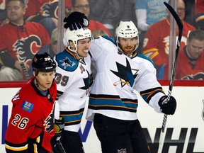 San Jose Sharks’ Martin Havlat, right, celebrates his goal with teammate Logan Couture, left, during NHL action in Calgary Sunday, Jan. 20, 2013. (THE CANADIAN PRESS/Jeff McIntosh)