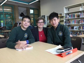 International students Khoa Pham, left, and Yuliang Lu with teacher Monica Dailey at St. Benedict Catholic Secondary School. Supplied photo
