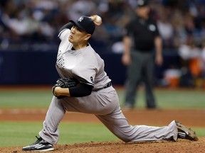In this Sept. 21, 2016, file photo, New York Yankees’ Masahiro Tanaka pitches to the Tampa Bay Rays in St. Petersburg, Fla. (AP Photo/Chris O’Meara, File)