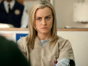 This image released by Netflix shows Taylor Schilling in a scene from Orange is the New Black (AP Photo/Netflix, JoJo Whilden)