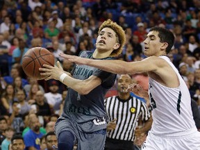 In this March 26, 2016, file photo, Chino Hills’ Lamelo Ball, left, goes to the basket against De La Salle’s Jordan Ratinho in Sacramento, Calif. (AP Photo/Rich Pedroncelli, File)