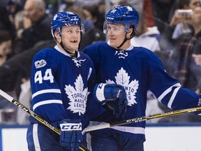 Maple Leafs defencemen Morgan Rielly (left) and Jake Gardiner celebrate their win over the Dallas Stars on Tuesday. Gardiner has become Toronto’s iron man with 126 consecutive games. (Craig Robertson/Toronto Sun)