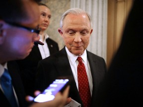 Sen. Jeff Sessions (R-AL), centre, talks with reporters after Senate confirmed him as the next U.S. Attorney General at the U.S. Capitol February 8, 2017 in Washington, D.C. The first U.S. senator to endorse Donald Trump during his presidential campaign, Sessions was confirmed by a 52-47 vote to become the nation's top law enforcement official after two decades as a Republican senator from Alabama. (Photo by Chip Somodevilla/Getty Images)