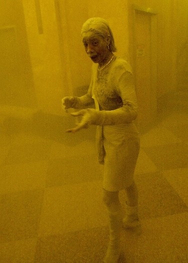 (FILES) This file photo taken on September 11, 2001 shows Marcy Borders covered in dust as she takes refuge in an office building after one of the World Trade Center towers in New York collapsed. The Twin Towers of the World Trade Center which were struck by hijacked airplanes collapsed on that day, claiming 2,753 lives. September 11, 2016m marks the fifteenth anniversary of the event. / AFP PHOTO / STAN HONDASTAN HONDA/AFP/Getty Images