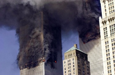 (FILES) This file photo taken on September 11, 2001 shows  the Twin Towers of the World Trade Center burning after two planes crashed into each building in New York. The buildings collapsed on that day claiming 2,753 lives. September 11, 2016 marks the fifteenth anniversary of this event. / AFP PHOTO / STAN HONDASTAN HONDA/AFP/Getty Images