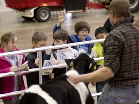 Juan, a student from St. Michaels Catholic School, puts up his hand to ask a questing during Dairy Days at the Oxford Auditorium on Wednesday. (BRUCE CHESSELL/Sentinel-Review)