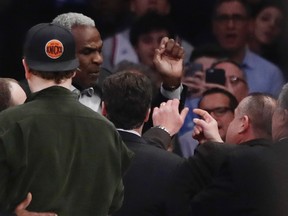Former New York Knicks and Toronto Raptors player Charles Oakley exchanges words with a security guard during the first half of an NBA basketball game between the New York Knicks and the LA Clippers Wednesday, Feb. 8, 2017, in New York. (AP Photo/Frank Franklin II)