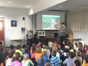 Submitted photo
Award-winning children’s illustrator Bill Slavin reads to children at the Wellington Public Library. Slavin’s visit this week was part of The Bay of Quinte Canada 150 Literacy Challenge.