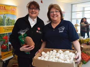 Stephanie Watkinson, left, with the Salvation Army, and Cindy Parry, right, with Outreach for Hunger, were at the KFA's Food Freedom Day Feb. 8. It's the third year the KFA has raised donations to benefit the food banks and according to Watkinson, those donation are more important every time.