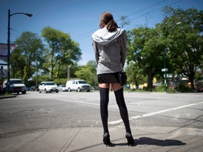 A sex trade worker is pictured in Vancouver, B.C., Wednesday, June 3, 2014. A recent study out of the University of Victoria contradicts public perceptions of why sex workers end up in the industry in finding that sex work is often an occupational choice. (THE CANADIAN PRESS/Jonathan Hayward)