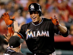 In this Aug. 25, 2014, file photo, Miami Marlins’ Giancarlo Stanton celebrates his home run against the Los Angeles Angels in Anaheim, Calif. (AP Photo/Chris Carlson, File)