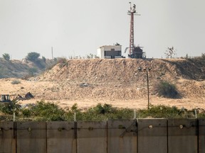 A picture taken from the southern Israel-Gaza Strip border on Feb. 7, 2017 shows a Hamas outpost on the Gaza Strip border behind Israel's controversial separation wall. (GETTY IMAGES)