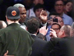 Former New York Knicks player Charles Oakley exchanges words with a security guard during an NBA game between the New York Knicks and the L.A. Clippers Wednesday, Feb. 8, 2017, in New York. (AP Photo/Frank Franklin II)