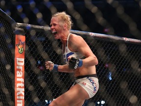 Holly Holm celebrates her victory over Ronda Rousey at UFC 193 event at Etihad Stadium on November 15, 2015 in Melbourne, Australia. (Quinn Rooney/Getty Images)
