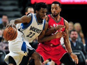 Timberwolves forward Andrew Wiggins drives against Raptors guard Norman Powell during Wednesday night’s game. (AP)