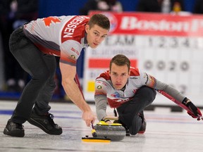 Skip Brendan Bottcher, throws a rock as second Bradley Thiessen sweeps at the 2017 Alberta Boston Pizza Cup men's curling championship in Westlock,on Wednesday February 8, 2017.