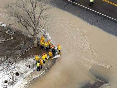 Emergency crews work to place sandbags Wednesday, Feb. 8, 2017, after the 21 Mile Dam near Montello, Nev., broke and caused flooding to the Union Pacific railroad line near Lucin and flooded the town of Montello. (Stuart Johnson/ The Deseret News via AP)/The Deseret News via AP)