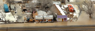 In a Wednesday, Feb. 8, 2017 photo, the town of the town of Montello, Nev., is flooded after 21 Mile Dam broke, and forced delays or rerouting for more than a dozen freight and passenger trains on a main rail line that runs through the area, said Union Pacific spokesman Justin E. Jacobs.  (Stuart Johnson/ The Deseret News via AP)