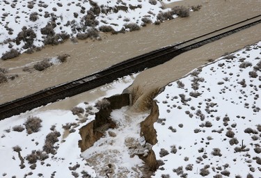 Train tracks are flooded Wednesday, Feb. 8, 2017, after the 21 Mile Dam near Montello, Nevada, broke and caused flooding to the Union Pacific railroad line near Lucin and flooded the town of Montello. The dam break forced delays or rerouting for more than a dozen freight and passenger trains on a main rail line that runs through the area, said Union Pacific spokesman Justin E. Jacobs.  (Stuart Johnson/ The Deseret News via AP)