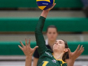 Meg Casault  of the University of Alberta Pandas, smashes the ball at Nikki Cornwall of the Trinity Western University Spartans at the Saville Centre in Edmonton in the Womens' final match of the Canada West final four Championships.