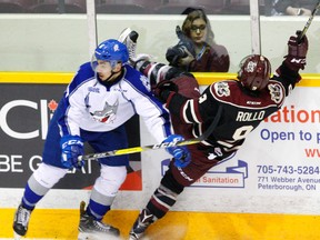 Peterborough Petes' Tyler Rollo is checked into the boards by Sudbury Wolves' Conor Ali during second period OHL action on Thursday February 9, 2017 at the Memorial Centre in Peterborough, Ont. Clifford Skarstedt/Peterborough Examiner/Postmedia Network