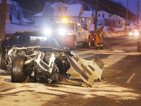 Crews clean up after a four-vehicle collision on the Kingsway in Sudbury, Ont. on Thursday February 9, 2017. The who drover this Corvette was sent to the pen on Wednesday. Gino Donato/Sudbury Star/Postmedia Network