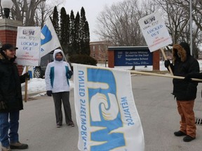 BRUCE BELL/THE INTELLIGENCER
Security guards at Sir James Whitney School for the Deaf picket in front of the school Friday afternoon. The seven guards have been locked out by their employer, Canadian Corps of Commissionaires, since Wednesday.