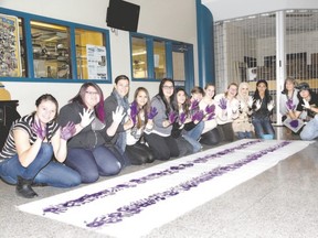 Using paint and handprints, students and staff at H.B. Beal secondary school in London created a replica of the two-row wampum belt in 2015. The original wampum belt was designed in 1613 by the Haudenoshonee (Iroquois) nation to signify an agreement with European settlers that the two nations would work alongside each other while respecting each others? differences. (London Free Press file photo)