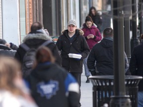 People walk down Princess Street in Kingston. The 2016 Census released this week showed only a one percent population growth since 2011.  (Ian MacAlpine/The Whig-Standard)