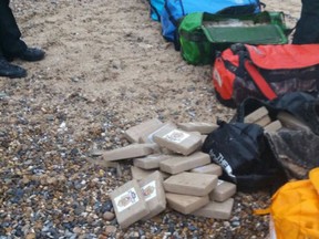 A handout picture released by Britain's National Crime Agency (NCA) on February 10, 2017 shows holdalls containing cocaine which were found at Hopton-on-Sea near Great Yarmouth, in Norfolk, southern England on February 9, 2017. (AFP PHOTO / NATIONAL CRIME AGENCY)