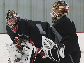 Sens goalies Craig Anderson (left) and Mike Condon take a break during practice yesterday. (Tony Caldwell/Ottawa Sun)