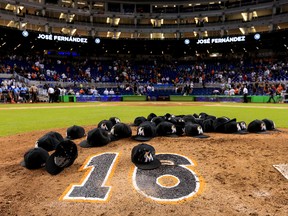 Miami Marlins hats are left on the pitching mound to honour Jose Fernandez after a game against the New York Mets at Marlins Park on September 26, 2016 in Miami. (Rob Foldy/Getty Images)