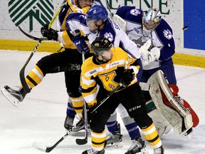 Kingston Frontenacs Ryan Cranford (foreground) looks for the puck behind Sudbury Wolves goalie MacKenzie Savard as Patrick Sanvido helps during Ontario Hockey League action at the Rogers K-Rock Centre on Friday, Feb. 10, 2017. Ian MacAlpine /The Whig-Standard/Postmedia Network