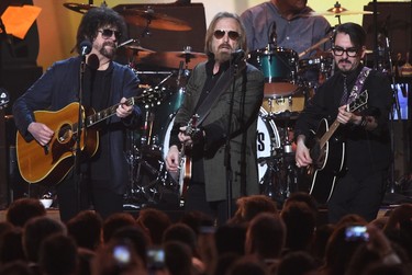 (L-R) Jeff Lynne, Tom Petty, and Dhani Harrison perform during the 2017 MusiCares Person of the Year, honouring Tom Petty, in Los Angeles on Feb. 10, 2017.  (ROBYN BECK/AFP/Getty Images)