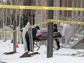 Durham Regional Police tend to the scene of a deadly shooting on Devineridge Ave., in Ajax, on Saturday, Feb. 11, 2017. The incident is the region's fourth homicide of the year, already tying the number of homicides for all of 2016. (John Hanley photo)