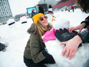 Alterna Savings Crackup Snowmania Challenge took place on the snow and ice covered field at TD place Stadium Saturday, Feb. 11, 2017. Here, 13-year-old Anastasia Bell's quick reflexes saved one of multiple snowmen she was building with a group of friends as it toppled over.