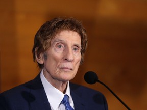 In a file photo from Nov. 14, 2014, Detroit Tigers owner Mike Ilitch listens during a news conference in Detroit. (AP Photo/Carlos Osorio, File)